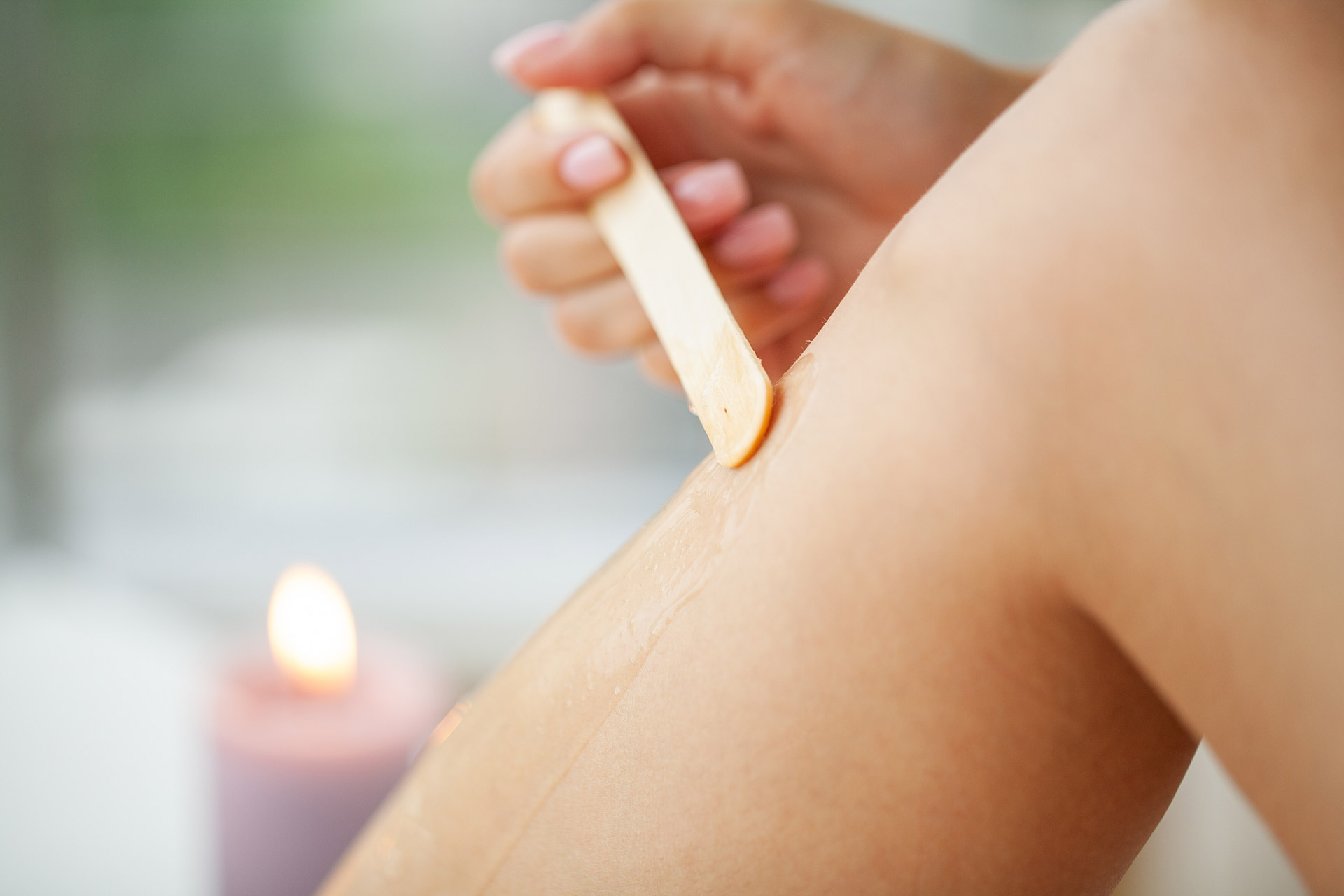 Depilation procedure with wax strip on the legs